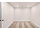 A finished basement area has neutral carpet and recessed lighting at 207 Pond View Ct # 3, Fuquay Varina, NC 27526