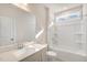 Well-lit bathroom featuring a shower and tub combo, light countertops, and tile floors at 207 Pond View Ct # 3, Fuquay Varina, NC 27526
