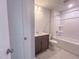 Full bathroom featuring a shower-tub combo and vanity with ample lighting at 207 Pond View Ct # 3, Fuquay Varina, NC 27526