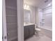 Modern bathroom featuring vanity with gray cabinets, granite counter, and tub/shower at 207 Pond View Ct # 3, Fuquay Varina, NC 27526