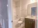 Bathroom featuring a shower-tub combo, dark vanity and modern fixtures at 207 Pond View Ct # 3, Fuquay Varina, NC 27526