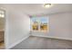 Carpeted bedroom featuring a view to the trees and access to an attached bathroom at 207 Pond View Ct # 3, Fuquay Varina, NC 27526