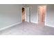 Spacious carpeted bedroom with closet and view of the stairs at 207 Pond View Ct # 3, Fuquay Varina, NC 27526