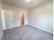 Neutral bedroom with plush carpeting and walk-in closet at 207 Pond View Ct # 3, Fuquay Varina, NC 27526