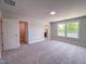 Spacious bedroom with plush carpet, natural lighting and access to en-suite bathroom at 207 Pond View Ct # 3, Fuquay Varina, NC 27526