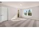 Comfortable carpeted bedroom with ample natural light from the double window at 207 Pond View Ct # 3, Fuquay Varina, NC 27526