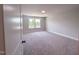 Bright bedroom featuring neutral carpet, ample natural light and a window view at 207 Pond View Ct # 3, Fuquay Varina, NC 27526