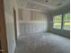 Unfinished bedroom with two windows and open doorframe at 207 Pond View Ct # 3, Fuquay Varina, NC 27526
