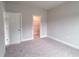 Neutral bedroom with new carpeting and a closet at 207 Pond View Ct # 3, Fuquay Varina, NC 27526