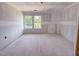 Partially completed bedroom featuring multiple windows, highlighting the construction phase before paint and finishing at 207 Pond View Ct # 3, Fuquay Varina, NC 27526