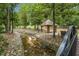 Scenic view of a gazebo in Fuquay Mineral Spring Park with a creek in the foreground at 207 Pond View Ct # 3, Fuquay Varina, NC 27526