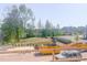 Community view from building showing landscaping, pond and surrounding properties at 207 Pond View Ct # 3, Fuquay Varina, NC 27526