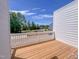 Outdoor deck overlooking a neighborhood with a view of trees and a blue sky at 207 Pond View Ct # 3, Fuquay Varina, NC 27526