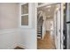 View of an entryway with hardwood floors, and an interior view of the staircase at 207 Pond View Ct # 3, Fuquay Varina, NC 27526