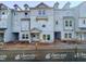 View of new construction townhome with gray siding and visible construction materials at 207 Pond View Ct # 3, Fuquay Varina, NC 27526