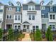 Charming townhouse with a well-manicured lawn and black metal fence at 207 Pond View Ct # 3, Fuquay Varina, NC 27526