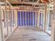 Image featuring wooden framework of a home interior including insulation, plumbing, and electrical components at 207 Pond View Ct # 3, Fuquay Varina, NC 27526