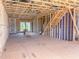 Unfinished interior framing showcases large open space and potential of a new home at 207 Pond View Ct # 3, Fuquay Varina, NC 27526