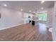 Modern kitchen featuring an island, white cabinets, stainless steel appliances, and hardwood floors at 207 Pond View Ct # 3, Fuquay Varina, NC 27526
