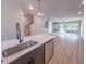Stylish kitchen with a large island, quartz countertops, stainless steel dishwasher, and an open concept at 207 Pond View Ct # 3, Fuquay Varina, NC 27526