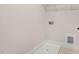 A simple laundry room includes washer/dryer hookups and a utility sink at 207 Pond View Ct # 3, Fuquay Varina, NC 27526