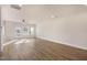 Spacious living room featuring hardwood floors, and natural light streaming in from the windows at 207 Pond View Ct # 3, Fuquay Varina, NC 27526