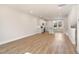 Open-concept living area showcasing hardwood floors and seamless transition to the modern kitchen at 207 Pond View Ct # 3, Fuquay Varina, NC 27526