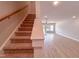 Open-concept living area showcasing hardwood floors and staircase at 207 Pond View Ct # 3, Fuquay Varina, NC 27526