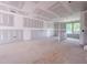 Spacious living room with large windows, bathed in natural light and awaiting personalization at 207 Pond View Ct # 3, Fuquay Varina, NC 27526