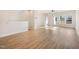 Open concept living room with hardwood floors and natural light streaming in at 207 Pond View Ct # 3, Fuquay Varina, NC 27526