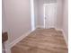 Room featuring vinyl plank floors and neutral paint at 207 Pond View Ct # 3, Fuquay Varina, NC 27526