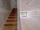 Staircase leading into a large living space with plenty of natural light and potential at 207 Pond View Ct # 3, Fuquay Varina, NC 27526