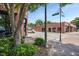 A quaint street corner featuring brick buildings with businesses, a street sign, and landscaping at 207 Pond View Ct # 3, Fuquay Varina, NC 27526