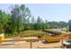 Scenic backyard view from a new construction home, overlooking lush greenery and a serene pond in a desirable community at 209 Pond View Ct # 4, Fuquay Varina, NC 27526