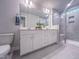 Spacious bathroom featuring a double vanity, modern fixtures, and a walk-in shower at 209 Pond View Ct # 4, Fuquay Varina, NC 27526