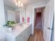 Bright bathroom with quartz countertop and modern vanity, and view of stairs at 209 Pond View Ct # 4, Fuquay Varina, NC 27526