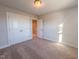 Bedroom featuring carpet and a large closet for ample storage at 209 Pond View Ct # 4, Fuquay Varina, NC 27526