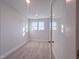 Spacious bedroom with recessed lighting and a large window at 209 Pond View Ct # 4, Fuquay Varina, NC 27526