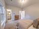 Bright bedroom with light-colored walls, carpet, and easy access to en-suite bathroom and closet at 209 Pond View Ct # 4, Fuquay Varina, NC 27526