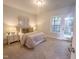 Cozy bedroom with plush carpet, neutral tones, and exterior access at 209 Pond View Ct # 4, Fuquay Varina, NC 27526