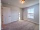 Bedroom with a window overlooking a tranquil view and a light-filled interior at 209 Pond View Ct # 4, Fuquay Varina, NC 27526