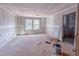 Spacious bedroom featuring two windows and unfinished walls at 209 Pond View Ct # 4, Fuquay Varina, NC 27526
