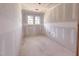 Bedroom featuring unfinished walls and ceilings with two windows at 209 Pond View Ct # 4, Fuquay Varina, NC 27526