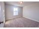 Bright bedroom featuring neutral walls, carpet flooring, and a window at 209 Pond View Ct # 4, Fuquay Varina, NC 27526