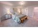 Bright bedroom with a walk-in closet, a wooden bench, and soft, neutral tones for a relaxing atmosphere at 209 Pond View Ct # 4, Fuquay Varina, NC 27526