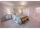 Bedroom featuring soft lighting, rustic bench, and a walk-in closet at 209 Pond View Ct # 4, Fuquay Varina, NC 27526