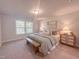 Cozy bedroom with a rustic bench, soft textures, and a well-lit window at 209 Pond View Ct # 4, Fuquay Varina, NC 27526