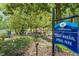 A beautiful community park featuring a bridge, walking trail, and a sign for Fuquay Mineral Spring Park at 209 Pond View Ct # 4, Fuquay Varina, NC 27526