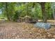 View of the park featuring a bridge over a creek, surrounded by lush greenery, and a historical marker at 209 Pond View Ct # 4, Fuquay Varina, NC 27526