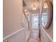 Hallway with wood floors, wainscoting, and staircase at 209 Pond View Ct # 4, Fuquay Varina, NC 27526